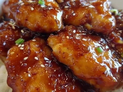 Sweet Hawaiian Crock Pot Chicken served on a plate with tropical fruits